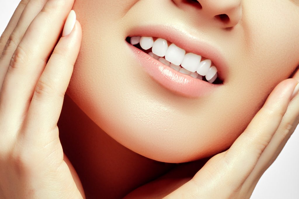 Woman teeth after whitening. Happy smiling woman. Dental health concept. Oral care. Beautiful white teeth. Stomatology concept. Beautiful model girl with clean skin